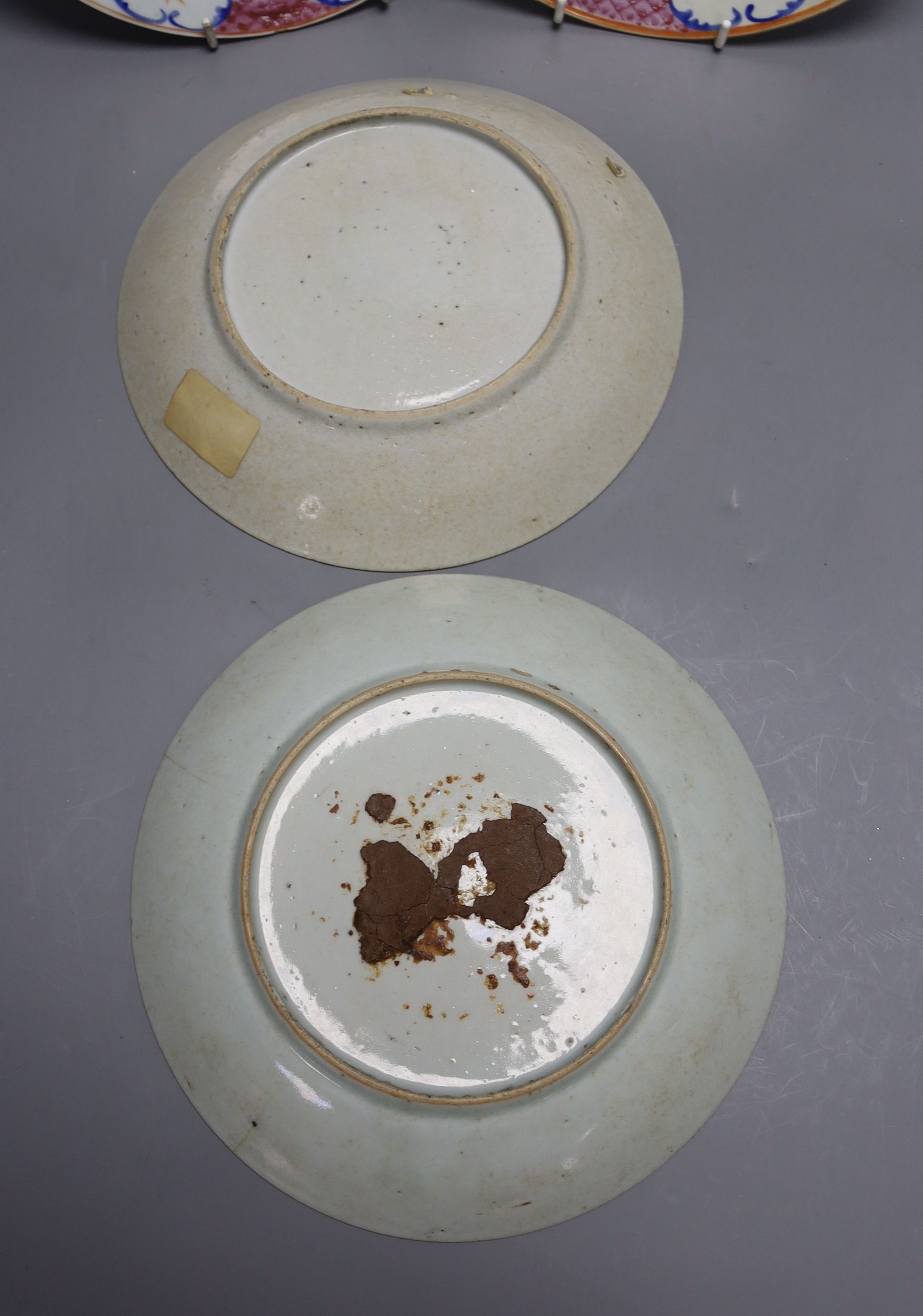 Three early 19th century Chinese polychrome-decorated shallow dishes and a matching plate (one repaired), Dia 22cm